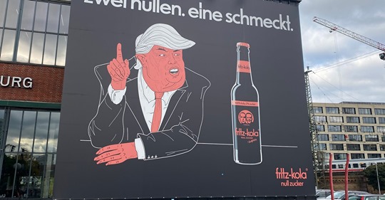 Deutsche Cola Werbung verhöhnt Donald Trump